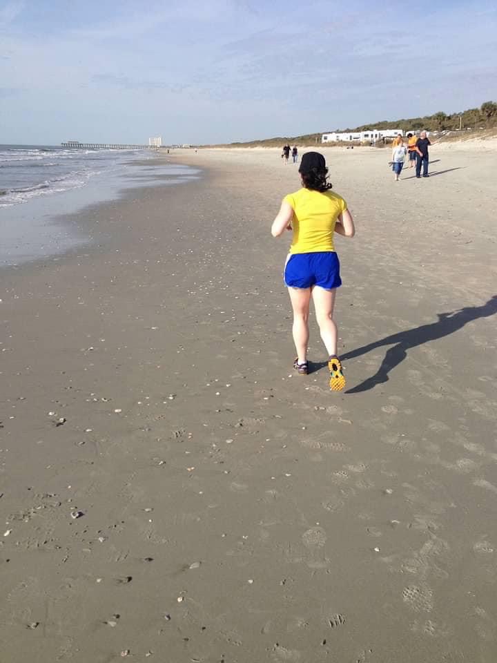 Stephanie Justus running on sand